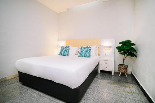 Ein Bett oder Betten in einem Zimmer der Unterkunft Swing & Pillows - Subang SS15