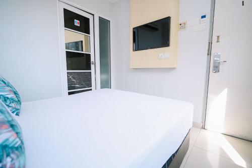 Ein Bett oder Betten in einem Zimmer der Unterkunft Swing & Pillows - Subang SS15