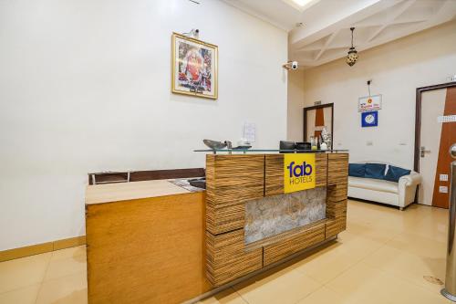 a room with a counter with a price sign on it at FabHotel Rivlet Premium - Nr Jama Masjid and Red Fort in New Delhi