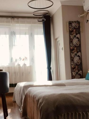 Ένα ή περισσότερα κρεβάτια σε δωμάτιο στο 中庭凤翥民宿古北口水镇店