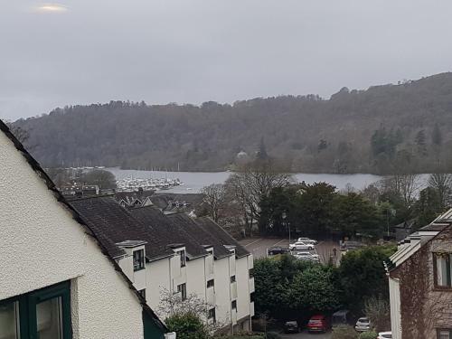 a view of a town with a lake and buildings at Bowness On Windermere, Excellent Apartment For 4 With Parking in Bowness-on-Windermere