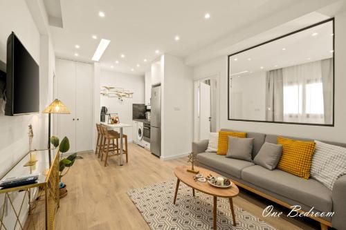 a living room with a couch and a table at Lazuli Hermes Apartments in Larnaka