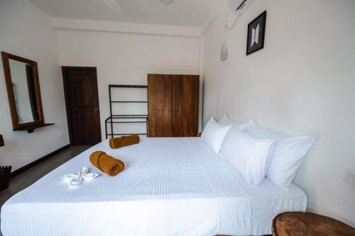 Ένα ή περισσότερα κρεβάτια σε δωμάτιο στο Sky House Ahangama
