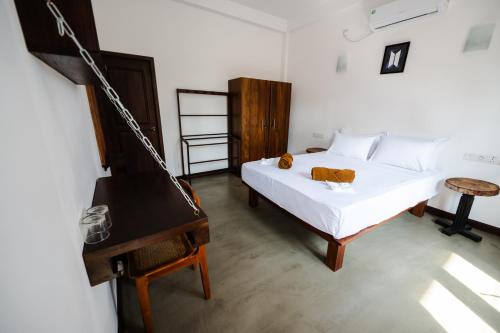 Ένα ή περισσότερα κρεβάτια σε δωμάτιο στο Sky House Ahangama