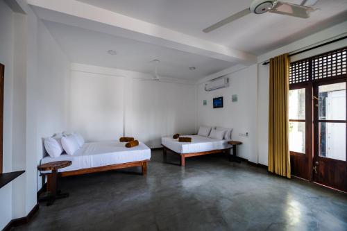 Ένα ή περισσότερα κρεβάτια σε δωμάτιο στο Sky House Ahangama