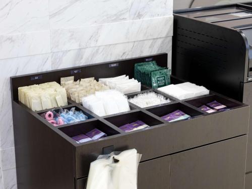 a display cabinet with alot of soap and towels at Comfort Inn Nagoya Sakae in Nagoya