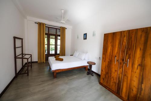 Ένα ή περισσότερα κρεβάτια σε δωμάτιο στο Sky House Ahangama