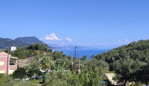 a view of the ocean from a hill at Markatis House with views to Corfu east in Káto Spílaion