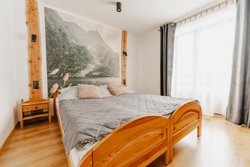 Postel nebo postele na pokoji v ubytování Apartamenty U Joli