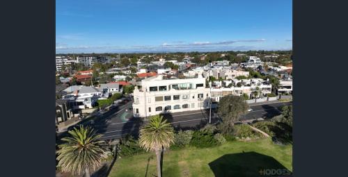 an aerial view of a city with white houses at Beach Road Hampton Holidays in Melbourne