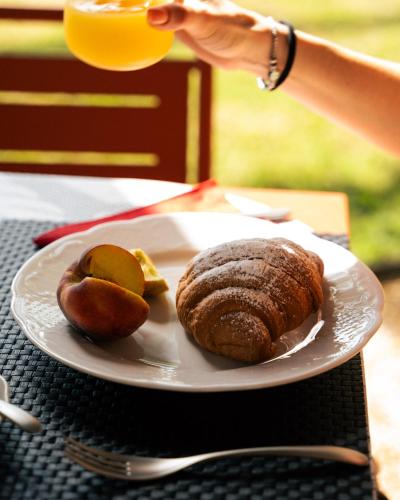 a plate of food on a table with a plate of food at Foresteria, Winery & Events Destination in Monforte dʼAlba