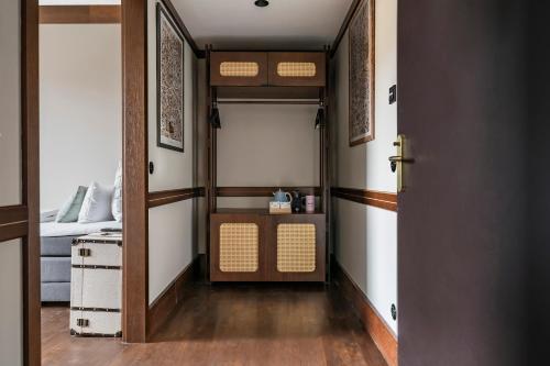 a room with a door and a bedroom with a bed at Numa Berlin Potsdamer Platz in Berlin