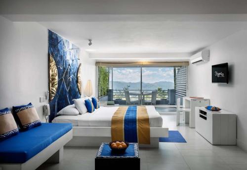 a bedroom with a king sized bed and a balcony at The Theva Residency in Kandy