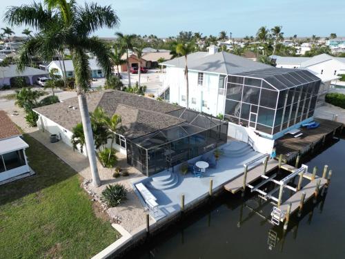 an aerial view of a house on the water at The Fish Shack in Saint James City