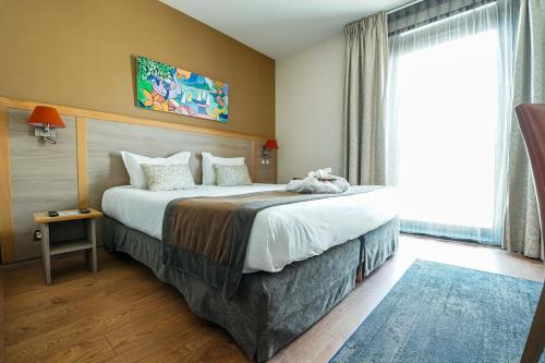 Hotel Vatel Bordeauxにあるベッド
