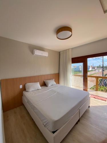 Ένα ή περισσότερα κρεβάτια σε δωμάτιο στο Bangalo Aconchegante - Praia Dulé ES