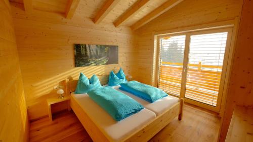 a bedroom with a bed in a log cabin at Ferienwohnung Zillertal - Schwemberger in Fügen