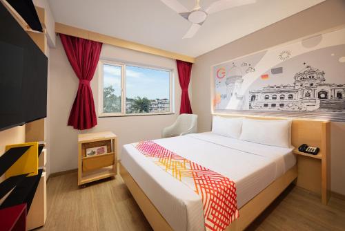 Una cama o camas en una habitación de Ginger Agartala