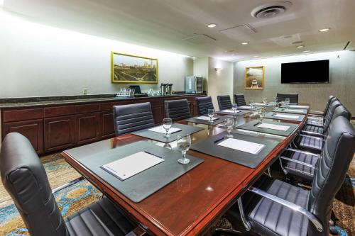 a conference room with a long table and chairs at DoubleTree by Hilton Tulsa Downtown in Tulsa