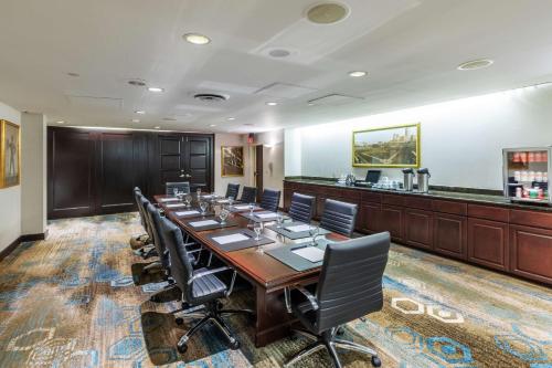 a large conference room with a long table and chairs at DoubleTree by Hilton Tulsa Downtown in Tulsa