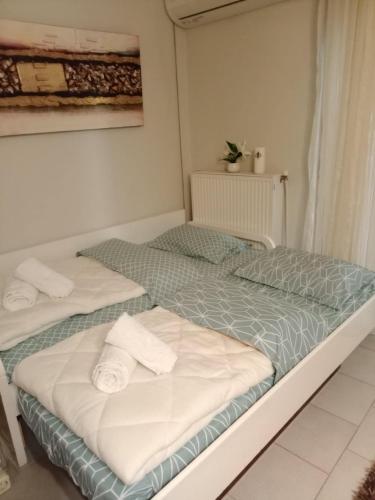 Ένα ή περισσότερα κρεβάτια σε δωμάτιο στο Mina's apartment