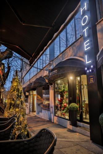 a store front with a christmas tree in front of it at Hotel Botanica in Belgrade