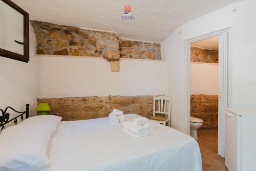 Postel nebo postele na pokoji v ubytování Dimora Rustica by Vivimy
