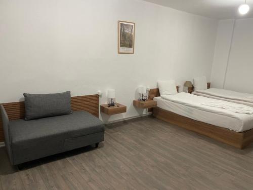 a bedroom with a bed and a chair in it at Sorta Hotel in Antalya