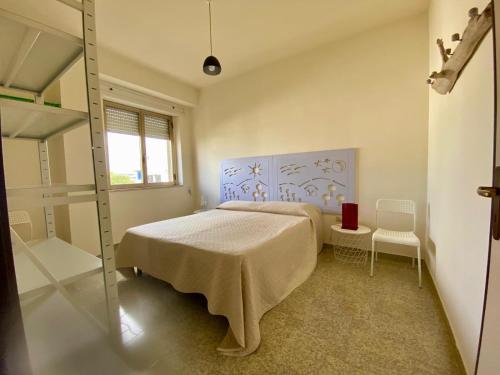 Ένα ή περισσότερα κρεβάτια σε δωμάτιο στο Villa Odetta - appartamento Attico