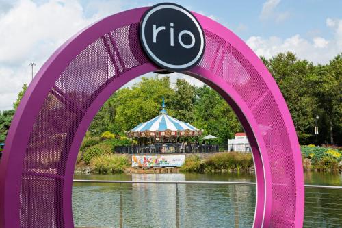 a large pink arch with a tent in the background at Holiday Inn Gaithersburg by IHG in Gaithersburg
