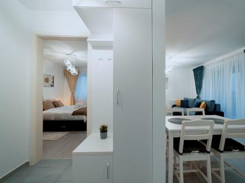 Postel nebo postele na pokoji v ubytování ANASTASIA Apart CORESI