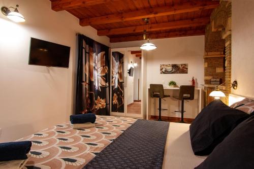 a bedroom with a bed and a dining room at Studio Mateo in Rovinjsko Selo