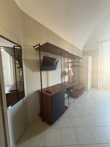 an office with a desk and a computer in a room at Santuzza Art Hotel Catania in Catania