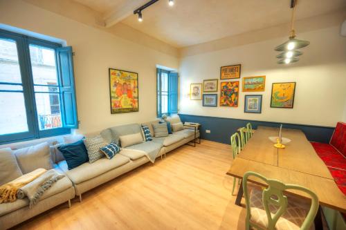 a living room with a couch and a table at Luxury & stylish 4bedroom, Valletta centre LDEM1-1 in Valletta
