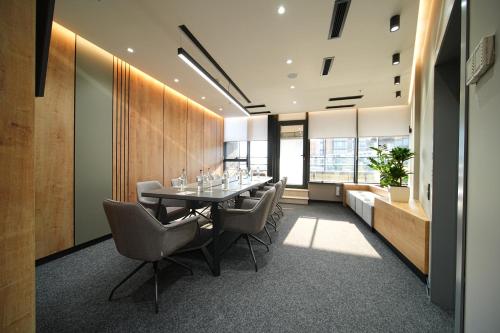 a dining room with a table and chairs at Yerevan Place Hotel in Yerevan