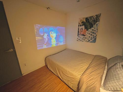 Кровать или кровати в номере Yakorea Hostel Dongdaemun