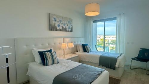 Voodi või voodid majutusasutuse Lua by Check-in Portugal toas