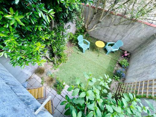 an overhead view of a garden with two chairs and a table at Villa Océan- Vue imprenable sur la côte Atlantique in Fouras