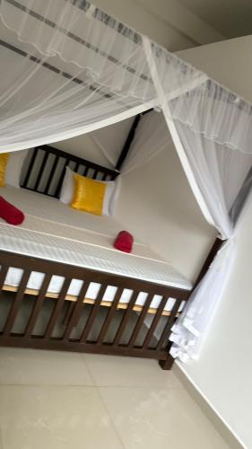 Una cama o camas en una habitación de The Point Mirissa