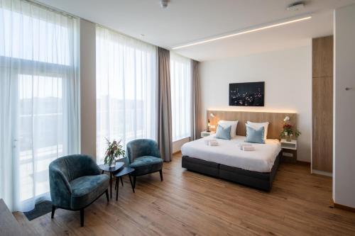 Postel nebo postele na pokoji v ubytování Hotel Den Briel