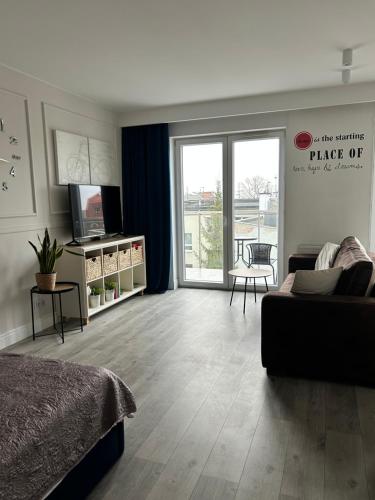 Posteľ alebo postele v izbe v ubytovaní Apartament City Centre 108