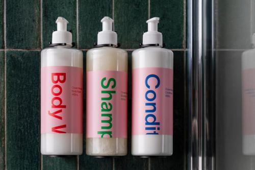 a group of four toothbrushes sitting next to each other at Numa Berlin Potsdamer Platz in Berlin