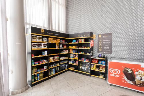 a room with shelves filled with toys and books at Beach Class Santa Maria by Easy Home in Recife