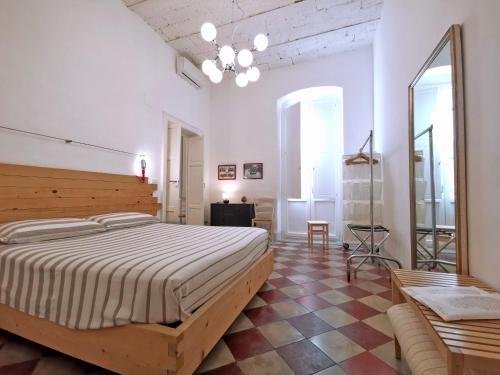 Ένα ή περισσότερα κρεβάτια σε δωμάτιο στο L'Officina