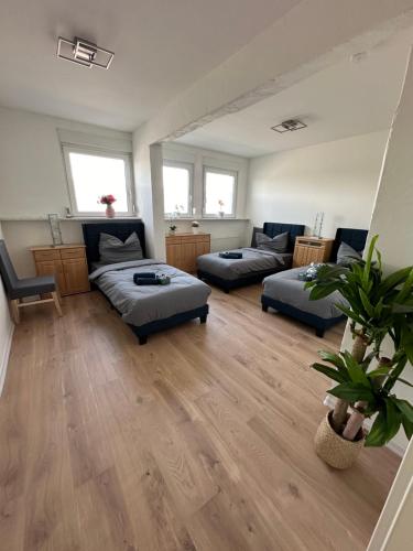 a living room with two beds and a couch at Gemütliche Unterkunft 3-Raum in Hoyerswerda