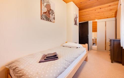 a bedroom with a bed in a room at Kuća za odmor MILA in Podgorje