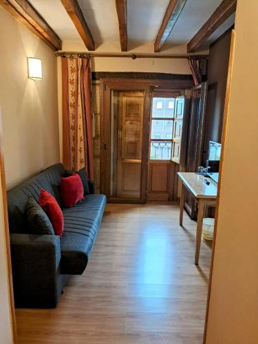 a living room with a couch and a table at Hotel San Roque in Reinosa