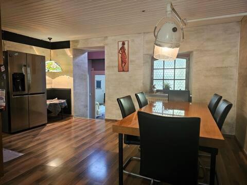 a kitchen and dining room with a table and chairs at Urbanes Lebensgefühl in Basel in Basel
