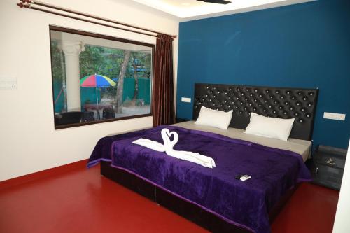 Postel nebo postele na pokoji v ubytování Kadal beach house marari