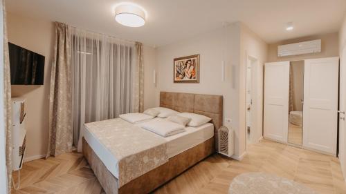 a bedroom with a bed in a room at Casa Lei by Villas Holiday in Malinska